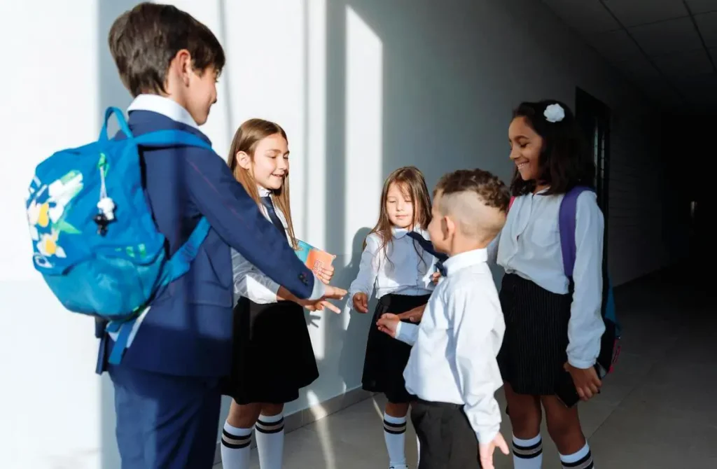 Children chatting in school uniforms