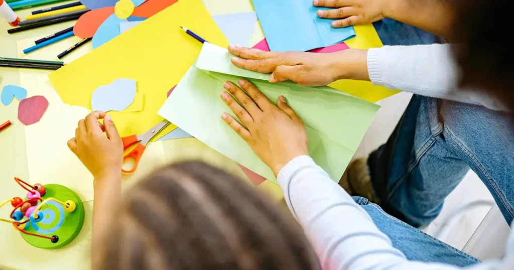 Happy Days Program with kids folding paper